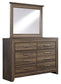 Juararo King Panel Bed with Mirrored Dresser, Chest and Nightstand